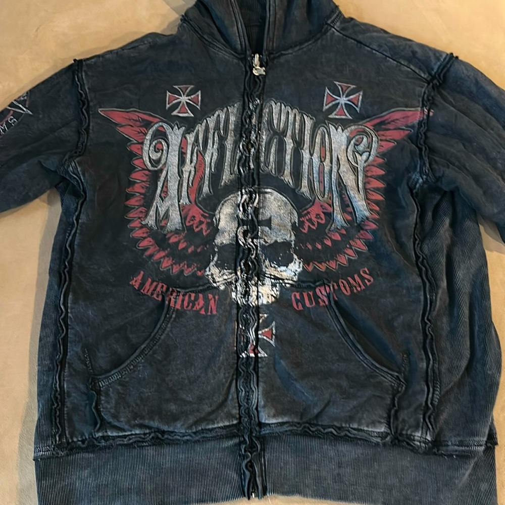 Very nice affliction hooded zipped sweatshirt style jacket.  It is reversible.